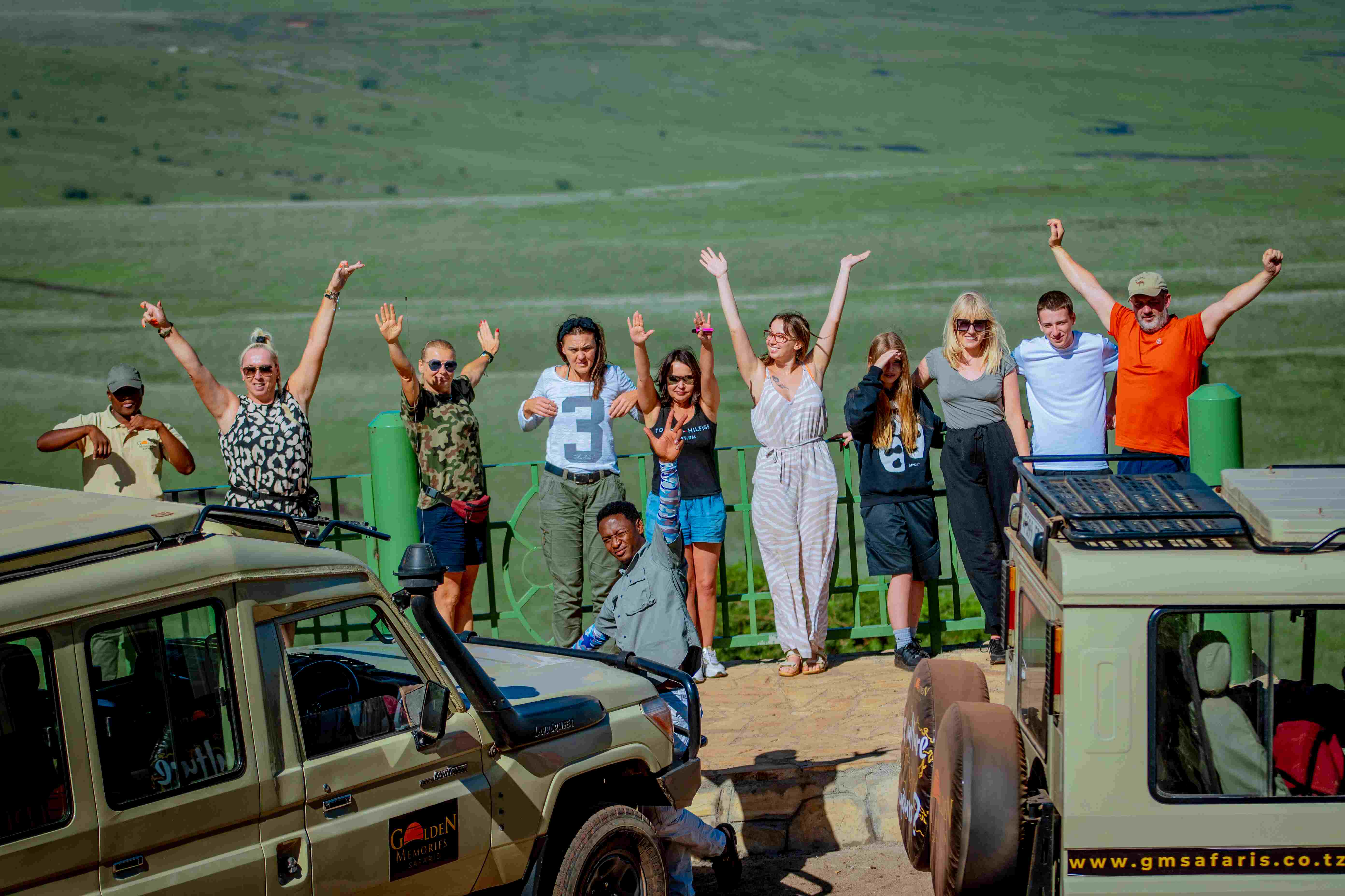 Open-top safari vehicle with group inside