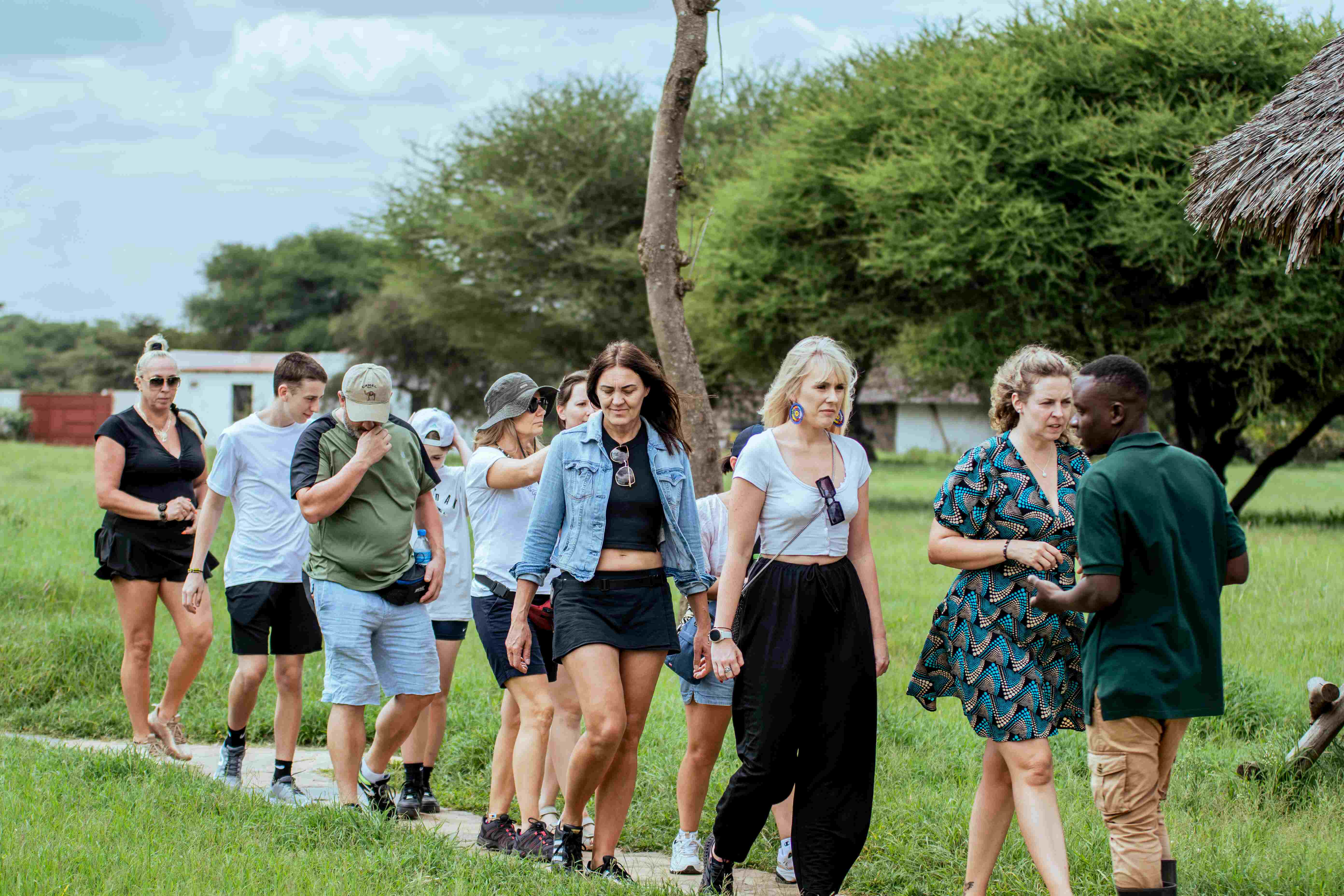 Safari guide explaining safety rules to tourists in vehicle