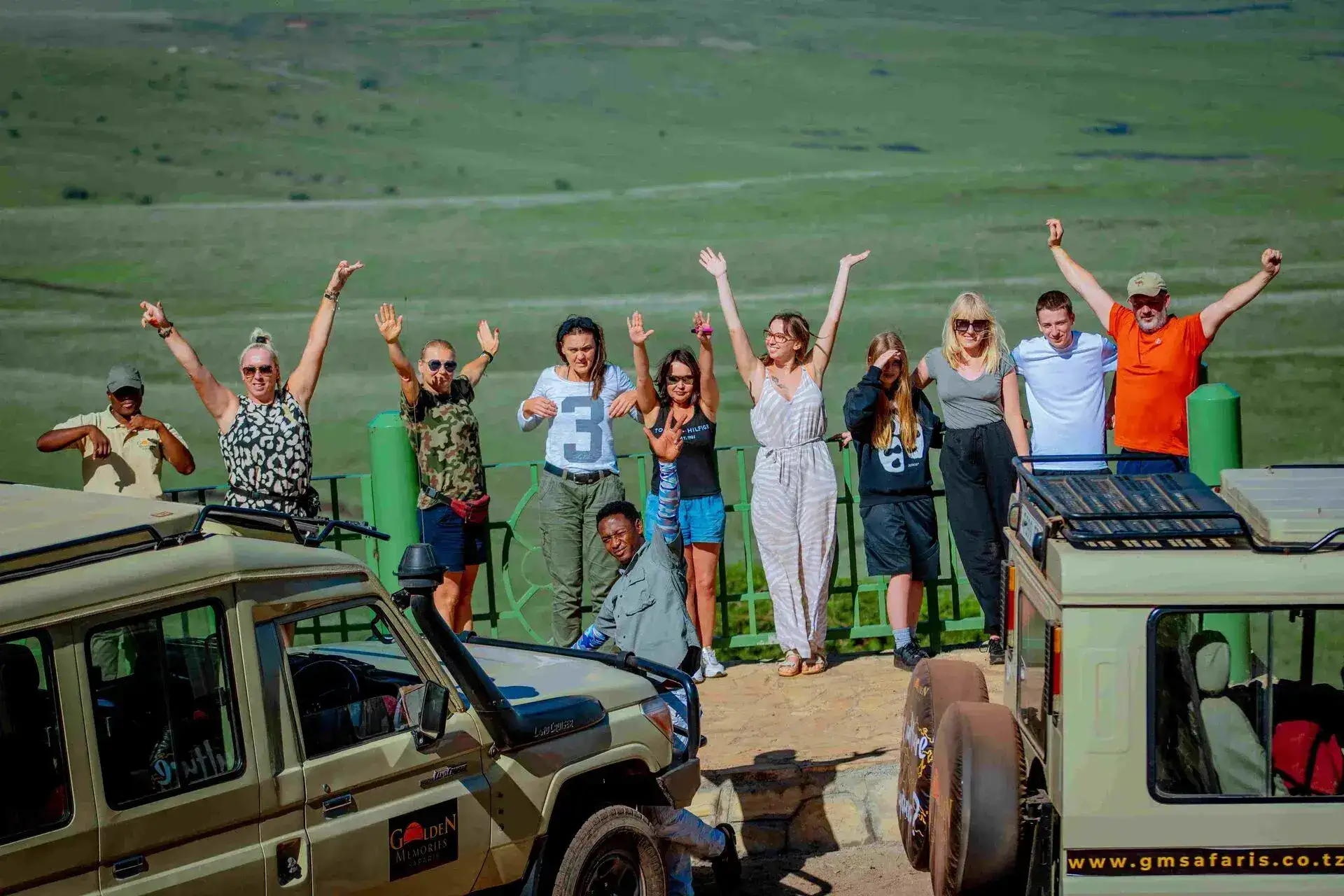 Open-top safari vehicle with group inside